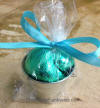 chocolate foil wrapped sea shells in beach pail bucket